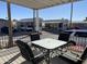 Covered patio with outdoor furniture, neighborhood view, and landscaping at 1318 W Chesapeake Dr, Apache Junction, AZ 85119