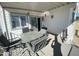 Covered patio with outdoor seating, sliding glass door and exterior decor at 1318 W Chesapeake Dr, Apache Junction, AZ 85119