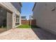 Paver patio and artificial turf in the backyard, perfect for entertaining and low maintenance at 14231 W Bronco Trl, Surprise, AZ 85387