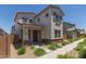 Charming two-story home features a desert landscape, covered porch, and neutral color palette at 14231 W Bronco Trl, Surprise, AZ 85387