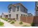 Side view of home featuring a desert landscape, block fence, and neutral color palette at 14231 W Bronco Trl, Surprise, AZ 85387