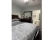 Bedroom with a large mirror and attached bathroom at 14922 W Port Au Prince Ln, Surprise, AZ 85374