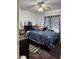 Bedroom with a bed, ceiling fan, and curtains at 14922 W Port Au Prince Ln, Surprise, AZ 85374