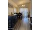 Charming dining area with wooden floors, table and chairs, and abundant natural light at 14922 W Port Au Prince Ln, Surprise, AZ 85374