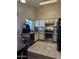 Well-equipped kitchen with tile floors, stainless steel appliances, and a practical layout at 14922 W Port Au Prince Ln, Surprise, AZ 85374