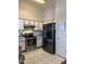 Functional kitchen with stainless steel appliances, ample counter space and modern fixtures at 14922 W Port Au Prince Ln, Surprise, AZ 85374