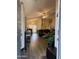 Open living room area, flowing from the entry with modern hardwood floors and neutral paint at 14922 W Port Au Prince Ln, Surprise, AZ 85374