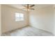 Well-lit bedroom features neutral paint, updated flooring, and ceiling fan at 15120 S Amado Blvd, Arizona City, AZ 85123