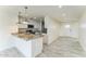 Well-lit kitchen featuring granite countertops, stainless steel appliances, and an island at 15120 S Amado Blvd, Arizona City, AZ 85123