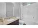 Bathroom with granite countertop, toilet, vanity mirror, and shower-tub combo at 15133 W Moreland St, Goodyear, AZ 85338