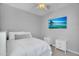 Bright bedroom with ceiling fan, TV, two bedside tables, and comfortable bed at 15133 W Moreland St, Goodyear, AZ 85338