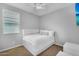 Cozy bedroom with neutral walls, ceiling fan, and comfortable bed with a window at 15133 W Moreland St, Goodyear, AZ 85338