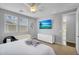 Bright bedroom features TV, carpet and window at 15133 W Moreland St, Goodyear, AZ 85338