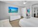 Bright bedroom features TV, carpet and view to the ensuite at 15133 W Moreland St, Goodyear, AZ 85338