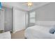 Cozy bedroom with neutral walls, ceiling fan, double door closet, and comfortable bed with headboard and a window at 15133 W Moreland St, Goodyear, AZ 85338