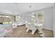 Open-concept living space with white sofa, tile floors, and a view to the yard at 15133 W Moreland St, Goodyear, AZ 85338