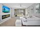 Open living room showcasing contemporary decor, fireplace, and sliding doors to backyard, ideal for relaxation at 15133 W Moreland St, Goodyear, AZ 85338