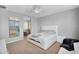 Bright bedroom with a mirror, carpet and view to the ensuite at 15133 W Moreland St, Goodyear, AZ 85338