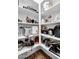 Walk-in pantry with lots of shelving provides ample storage space for kitchen supplies and appliances at 15133 W Moreland St, Goodyear, AZ 85338