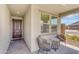 Cozy porch featuring comfortable seating and ample sunlight, perfect for relaxation and enjoying neighborhood views at 15133 W Moreland St, Goodyear, AZ 85338