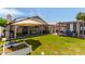 Spacious backyard featuring a gazebo, outdoor seating, a well-maintained lawn, and mature landscaping at 17606 N 2Nd Ave, Phoenix, AZ 85023