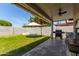 Cozy backyard featuring a barbecue grill, umbrella and a well-maintained lawn, perfect for outdoor gatherings at 17606 N 2Nd Ave, Phoenix, AZ 85023