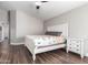 Primary bedroom showcases a light wood floor, ceiling fan, and a white wood dresser at 17606 N 2Nd Ave, Phoenix, AZ 85023