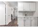 Hallway includes white cabinets for storage and access to additional rooms at 17606 N 2Nd Ave, Phoenix, AZ 85023