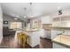 Open kitchen with an island, modern appliances, granite countertops, and wood floors at 17606 N 2Nd Ave, Phoenix, AZ 85023