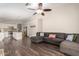 Spacious living room features a large sectional, hardwood floors and flows to an open kitchen at 17606 N 2Nd Ave, Phoenix, AZ 85023