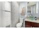 Bathroom featuring a glass bowl sink, granite countertop, dark wood cabinets, shower, and toilet at 20250 N 6Th Dr # 3, Phoenix, AZ 85027