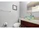 Bathroom featuring a glass bowl sink, granite countertop, dark wood cabinets, and a framed art piece at 20250 N 6Th Dr # 3, Phoenix, AZ 85027