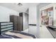 Bedroom with light blue walls, gray trim, and built in gray cabinets, drawers, and closet space at 20250 N 6Th Dr # 3, Phoenix, AZ 85027