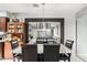Elegant dining room with seating for six, accented by a large mirror and a view to the living space at 20250 N 6Th Dr # 3, Phoenix, AZ 85027