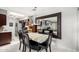 Stylish dining area with modern light fixture, with view to kitchen and living spaces, perfect for entertaining guests at 20250 N 6Th Dr # 3, Phoenix, AZ 85027
