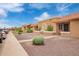 A row of well-maintained townhomes, featuring desert landscaping, offering curb appeal and a sense of community at 20250 N 6Th Dr # 3, Phoenix, AZ 85027