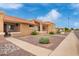 Charming single-story home featuring a well-maintained front yard with desert landscaping under a partly cloudy blue sky at 20250 N 6Th Dr # 3, Phoenix, AZ 85027