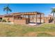 Exterior of the property with lush green lawn and outdoor lounge area at 20250 N 6Th Dr # 3, Phoenix, AZ 85027