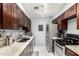 Modern kitchen with stainless steel appliances, granite countertops, and sleek dark cabinets for a contemporary feel at 20250 N 6Th Dr # 3, Phoenix, AZ 85027