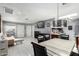 Open-concept space with living, dining, and kitchen areas, enhanced by ample lighting and tile flooring at 20250 N 6Th Dr # 3, Phoenix, AZ 85027