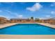Community pool with a bright blue interior reflecting the clear blue sky above at 20250 N 6Th Dr # 3, Phoenix, AZ 85027