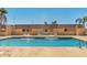 Community pool with lounge chairs and splash fountains offering a refreshing escape at 20250 N 6Th Dr # 3, Phoenix, AZ 85027