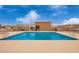 Community pool featuring lounge chairs, tables, blue water, and a clear sky, perfect for relaxation at 20250 N 6Th Dr # 3, Phoenix, AZ 85027