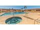 Community pool area featuring hot tub and lounge chairs for residents at 20250 N 6Th Dr # 3, Phoenix, AZ 85027
