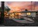 Inviting backyard featuring a private pool, string lights, and ample space for outdoor seating, perfect for relaxation at 2062 S Emerson --, Mesa, AZ 85210