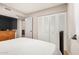 This cozy bedroom features a closet and a dresser with mounted TV for comfortable living at 2062 S Emerson --, Mesa, AZ 85210
