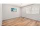 Bright bedroom with wood floors, neutral paint, and a window for plenty of natural light at 2062 S Emerson --, Mesa, AZ 85210