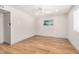 Spacious bedroom featuring wood floors, neutral paint, ceiling fan and ample natural light at 2062 S Emerson --, Mesa, AZ 85210