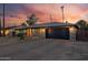 Charming brick home featuring a wide driveway and a well-maintained front yard, complemented by a beautiful sunset backdrop at 2062 S Emerson --, Mesa, AZ 85210