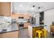 Bright eat-in kitchen with stainless appliances, light wood cabinets, and a gray countertop island at 2062 S Emerson --, Mesa, AZ 85210
